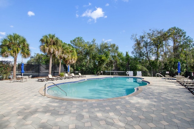 5209 Manorwood Dr Unit 3A, Sarasota, FL 34235 - community pool featuring a patio area and view of scattered trees