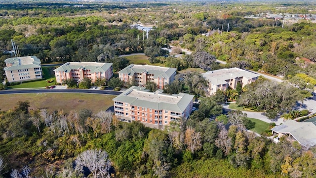 5209 Manorwood Dr Unit 3A, Sarasota, FL 34235 - aerial view of property and surrounding area with a heavily wooded area