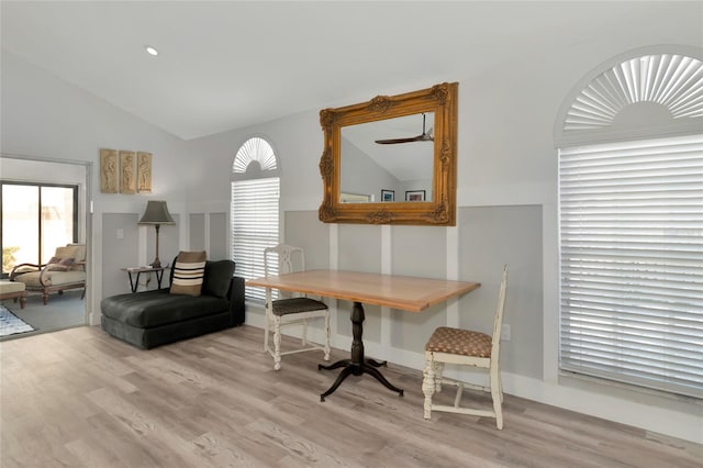 home office with light hardwood / wood-style flooring and vaulted ceiling