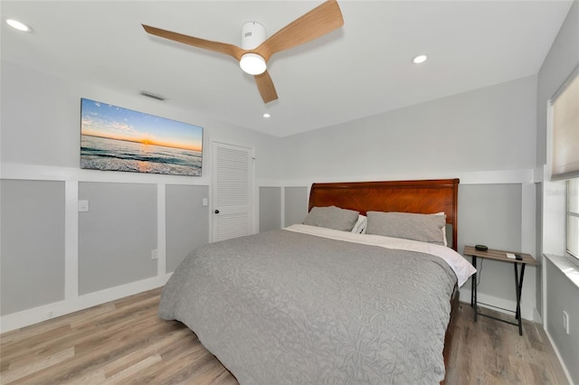 bedroom featuring hardwood / wood-style floors and ceiling fan