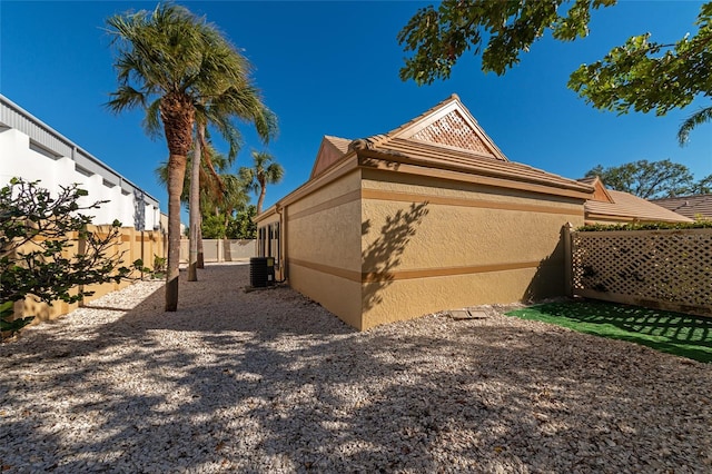 back of property with central AC unit