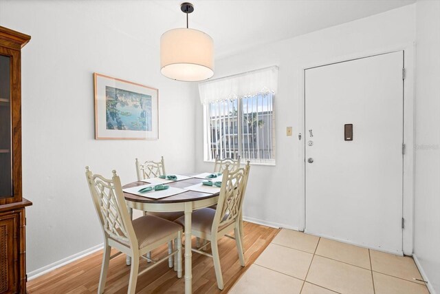 dining area with light hardwood / wood-style floors