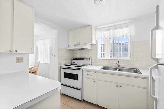 5902 Garden Ln Unit A24, Bradenton, FL 34207 - kitchen with white appliances, under cabinet range hood, and light countertops