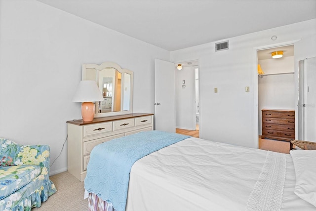 5902 Garden Ln Unit A24, Bradenton, FL 34207 - bedroom with a walk in closet and light carpet