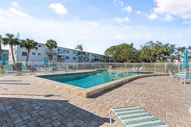 view of swimming pool featuring a patio area