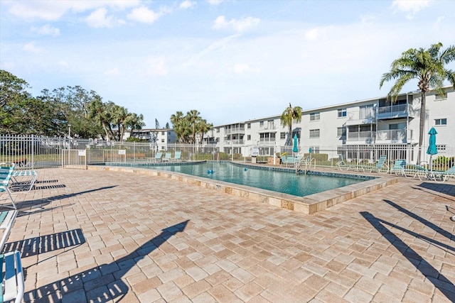 view of swimming pool featuring a patio area