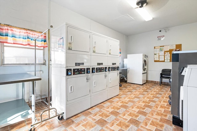 5902 Garden Ln Unit A24, Bradenton, FL 34207 - shared laundry room featuring estacked washer and dryer and ceiling fan