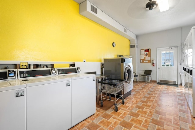 clothes washing area featuring ceiling fan, independent washer and dryer, and stacked washer and dryer