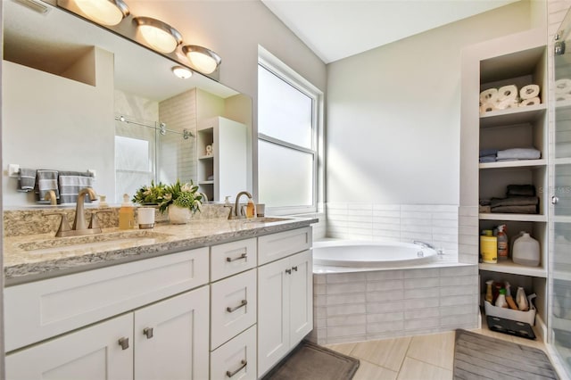 bathroom featuring vanity, tile patterned floors, and independent shower and bath