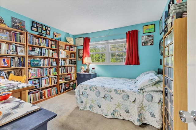 carpeted bedroom with a textured ceiling