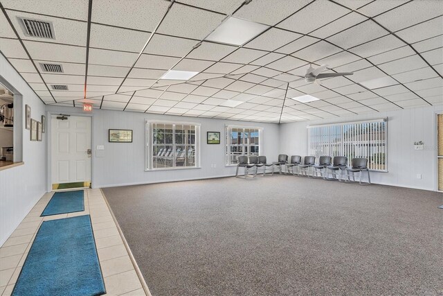 workout area featuring carpet floors, a paneled ceiling, and visible vents