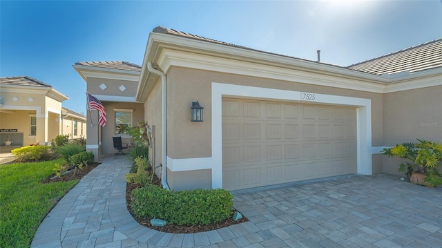 7525 Alumni Trl, Sarasota, FL 34243 - garage with decorative driveway