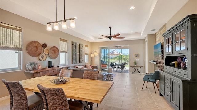 7525 Alumni Trl, Sarasota, FL 34243 - dining area featuring a tray ceiling, light tile patterned floors, a ceiling fan, and recessed lighting