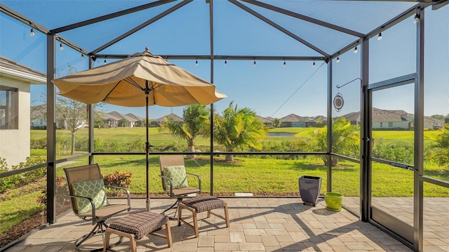 7525 Alumni Trl, Sarasota, FL 34243 - unfurnished sunroom featuring a residential view