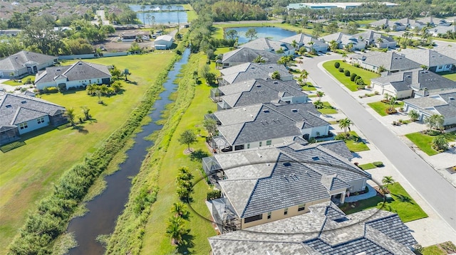 birds eye view of property featuring a water view