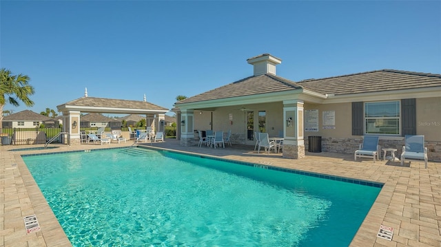 view of pool featuring a gazebo and a patio