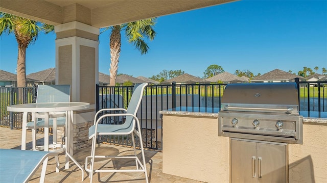 view of patio featuring area for grilling and exterior kitchen