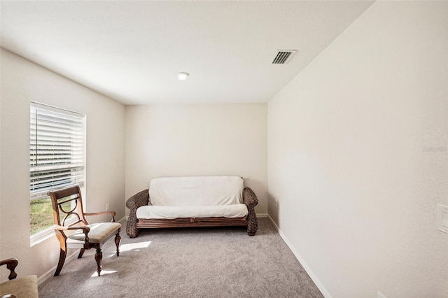 living area with light carpet