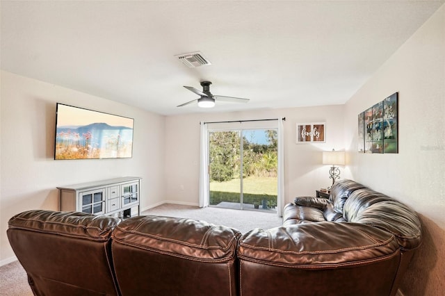 living room with carpet floors and ceiling fan