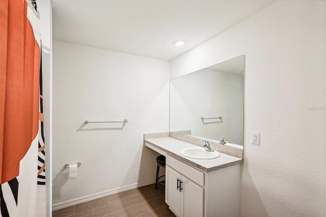 bathroom featuring vanity and hardwood / wood-style flooring