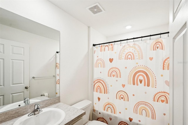 full bathroom featuring vanity, toilet, and shower / tub combo with curtain