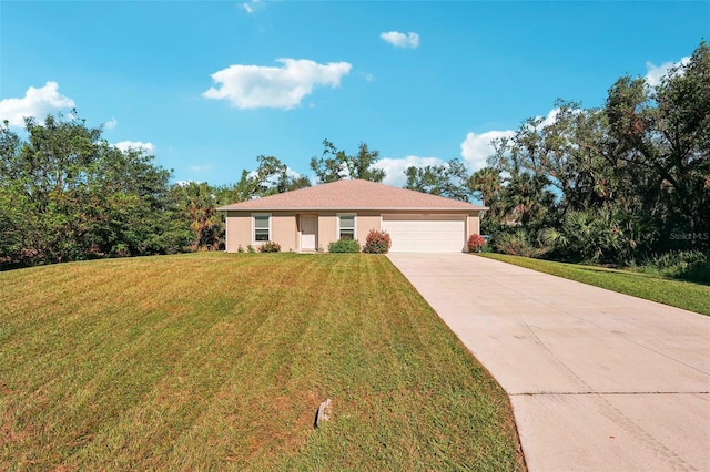 view of front of house with a garage and a front yard