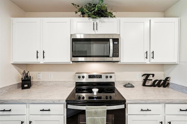 kitchen featuring white cabinets and stainless steel appliances