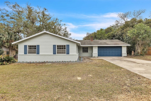 single story home with a garage and a front lawn