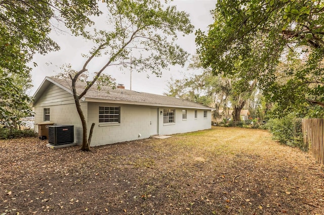 rear view of property featuring central air condition unit