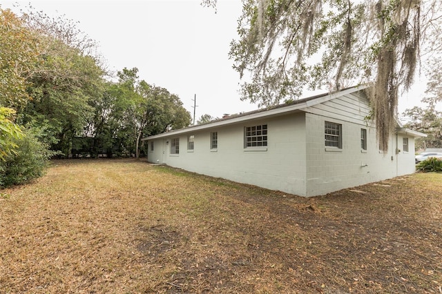 view of home's exterior featuring a yard