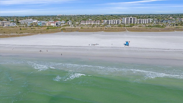 drone / aerial view with a beach view and a water view