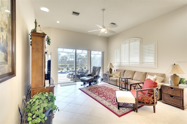 tiled living room with ceiling fan