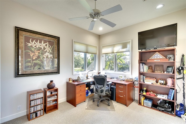 carpeted office featuring ceiling fan