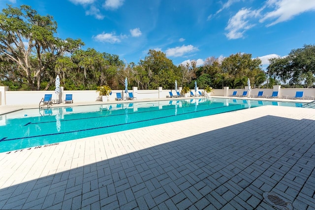 view of swimming pool with a patio