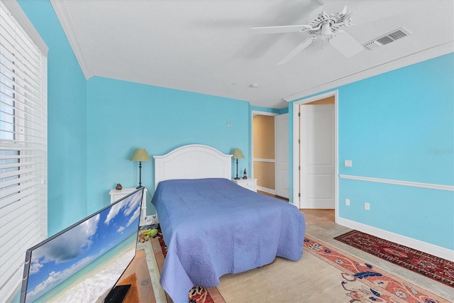 bedroom featuring carpet flooring, ceiling fan, and ornamental molding