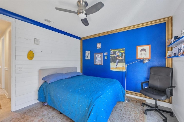 bedroom featuring ceiling fan and crown molding