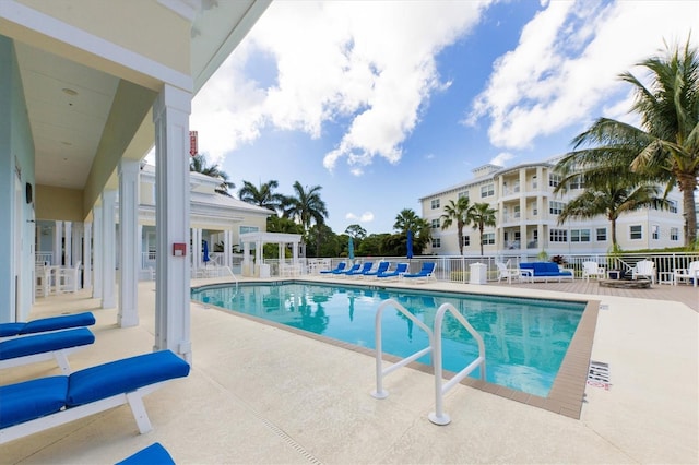 view of swimming pool with a patio