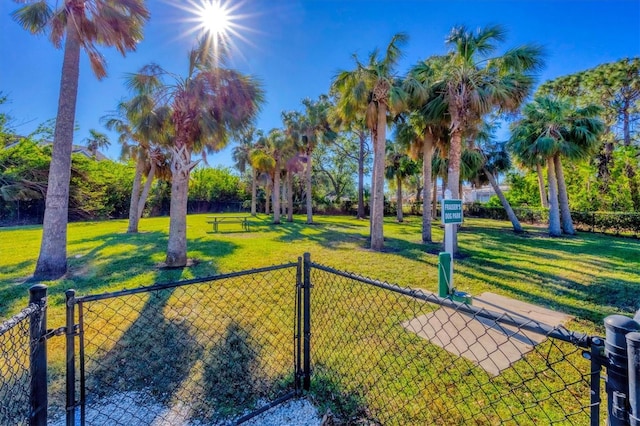 view of property's community with a lawn