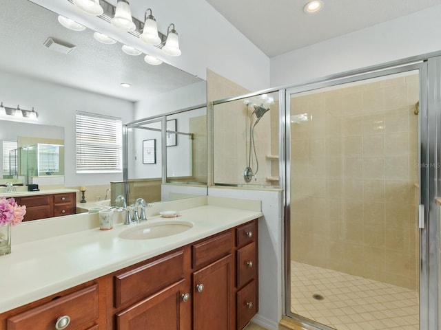 bathroom with vanity and walk in shower