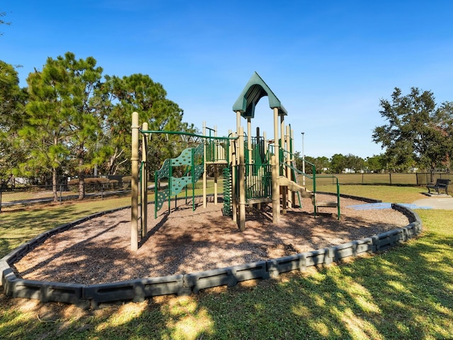 view of playground featuring a lawn