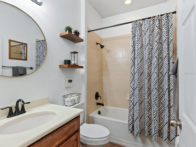 full bathroom featuring shower / tub combo, vanity, and toilet