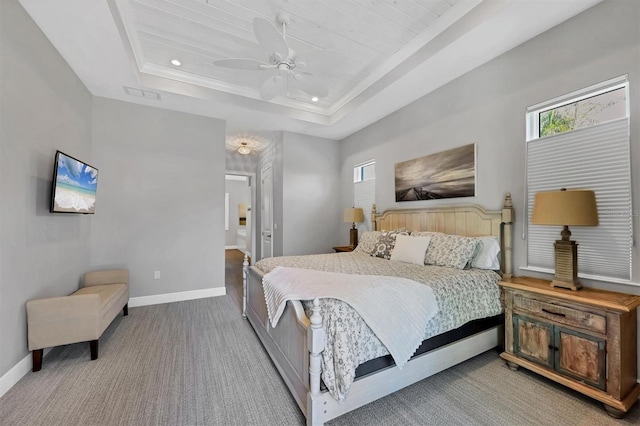 carpeted bedroom with a raised ceiling, ceiling fan, and wooden ceiling