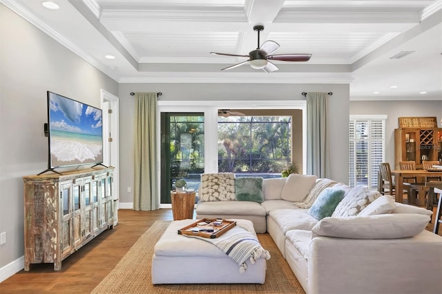 living room with beam ceiling, ceiling fan, coffered ceiling, light hardwood / wood-style floors, and ornamental molding