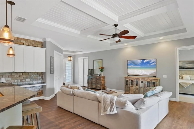 living room with coffered ceiling, crown molding, hardwood / wood-style flooring, ceiling fan, and beam ceiling