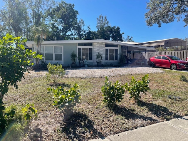 single story home with a carport