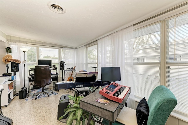 home office featuring a textured ceiling and lofted ceiling