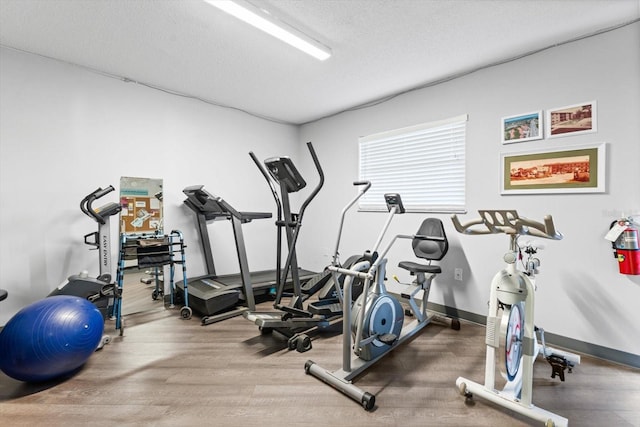 workout room featuring a textured ceiling