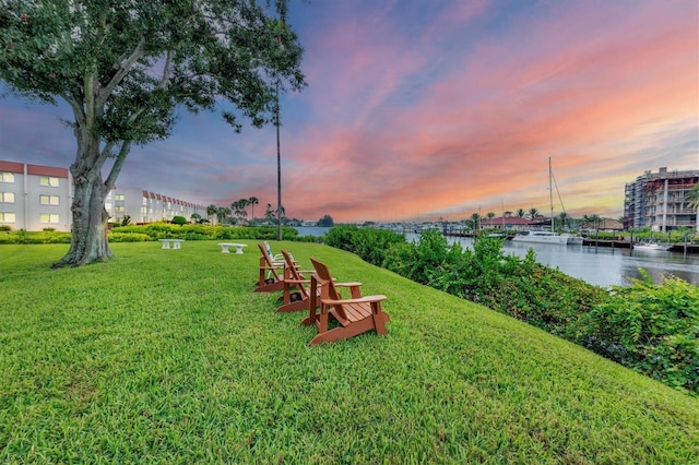 yard at dusk with a water view