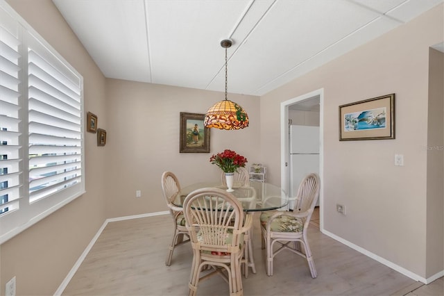 dining area featuring light wood-type flooring