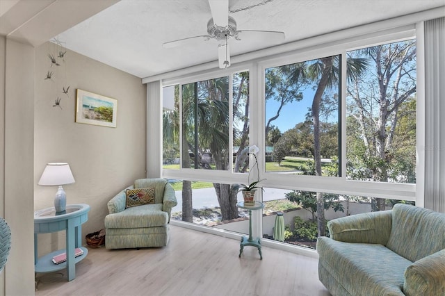 sitting room featuring hardwood / wood-style flooring and ceiling fan